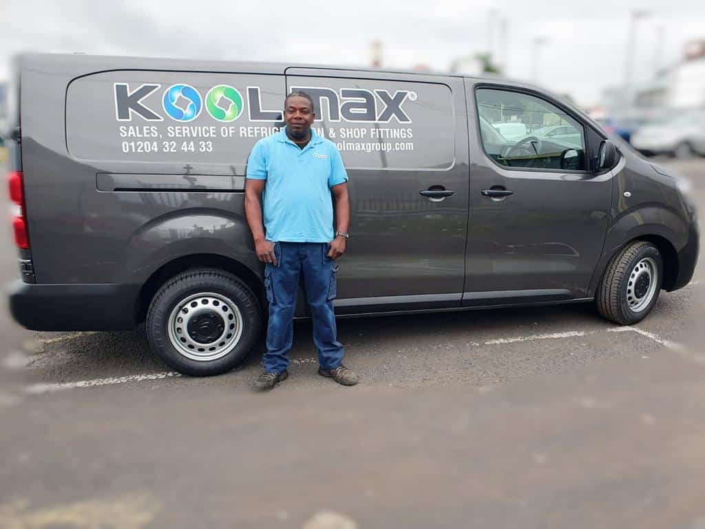 Koolmax Group engineer stood in front of Koolmax van